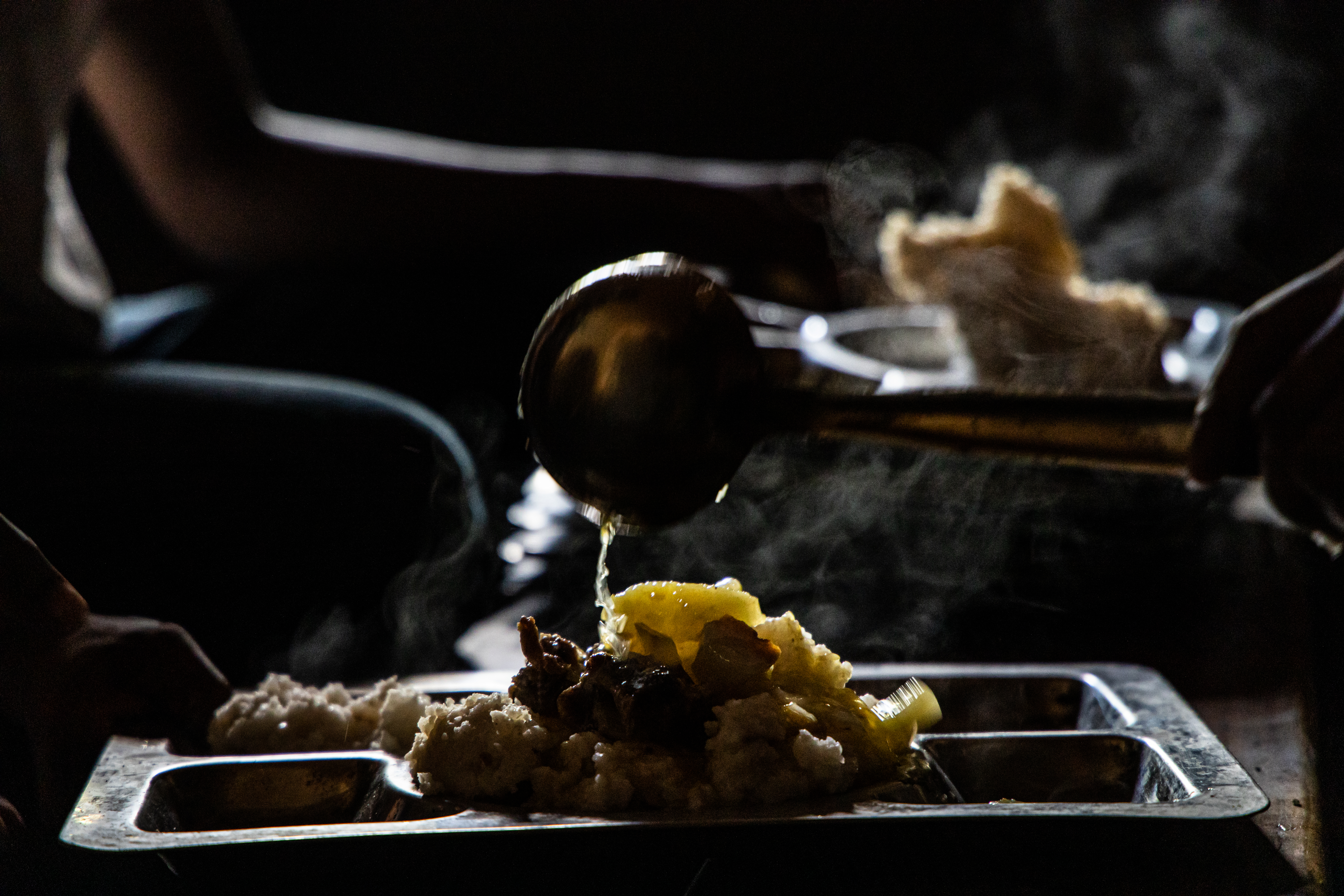 food being poured into a plate