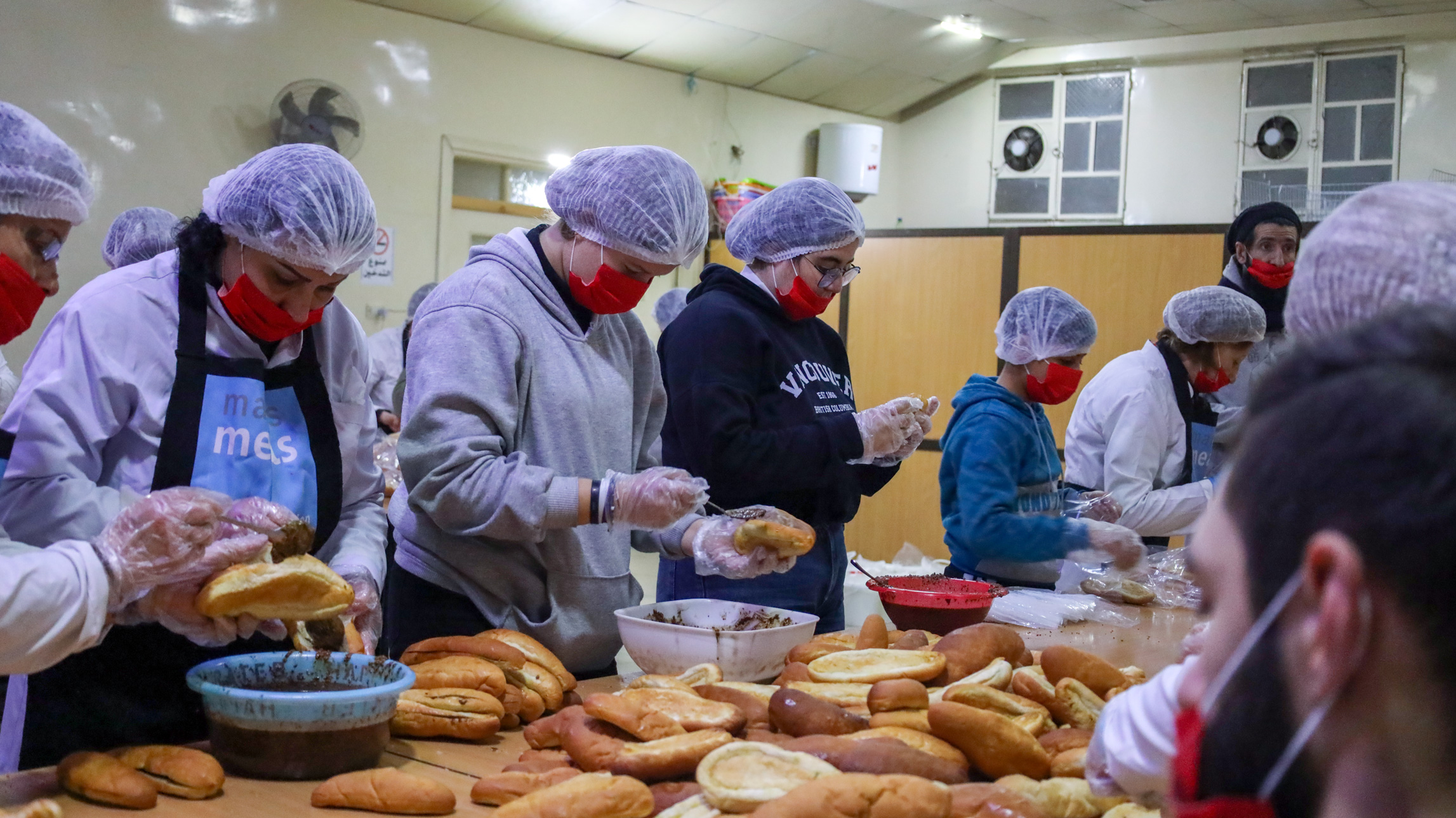 a team of volunteers preparing food