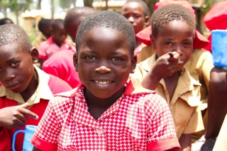 School children smiling and looking into camera