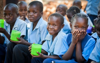 Children at school eating Mary's Meals.