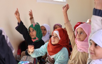Children from Yemen learning in class. 