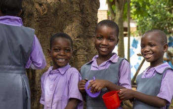Children waiting to be served Mary's Meals at school in Malawi.
