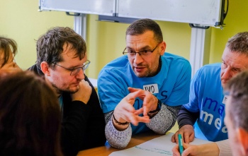 Volunteers in a meeting at a Mary's Meals event