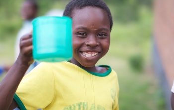 A child in Malawi enjoys food from Mary's Meals