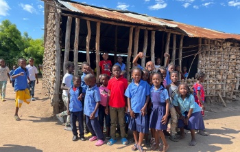 A group of children outside a school in Mozambique