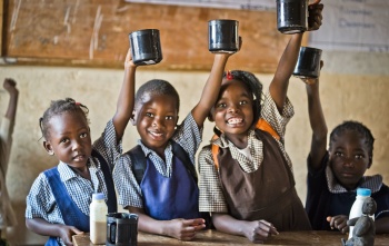 Zambia 10th – children raising mugs