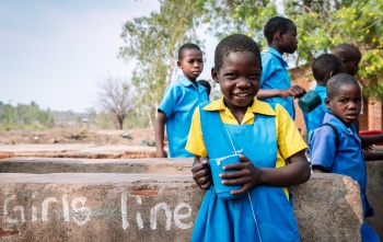 Children in Malawi eating Mary's Meals