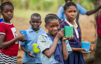 Children in Malawi eating Mary's Meals