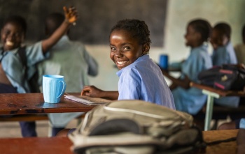 2023 - Zambia - A girl smiling, happy to be in class 