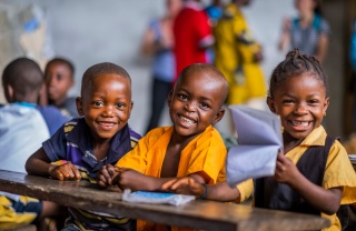 Children smiling in class in Liberia