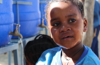 close up of a young girl with tears in her eyes