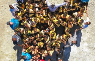 aerial shot of a group of people joined together in the shape of a love heart