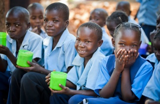 Children at school eating Mary's Meals.