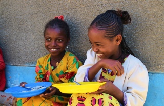 Two girls laughing together