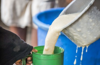 porridge being poured into a mug