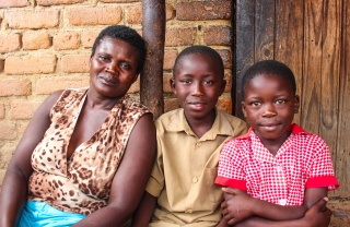 Picture of mother & children looking into camera