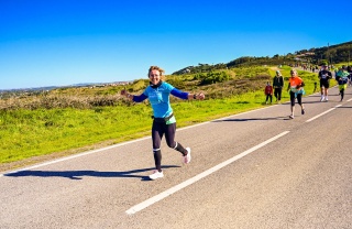 MM Volunteer running in a marathon to raise money for charity.