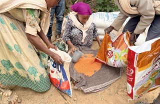 Volunteer cooks preparing meals.