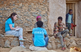 mid shot of group of people sitting and talking