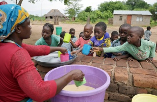 2025 - Zambia - children being served meals