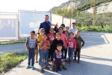 group of children posing for a photo outdoors