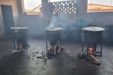 Image of pots cooking on stoves showing meals being prepared.