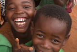 School children smiling and looking into camera