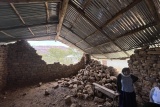 Image showing a storage shed with two of it's walls collapsed.