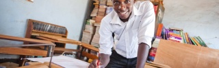 A child from Zambia enjoying drawing while at school.