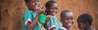 Children in Malawi eating Mary's Meals