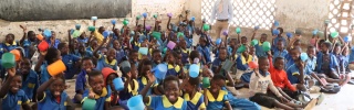 Alexander Lulanga and his classroom of children in Malawi. 