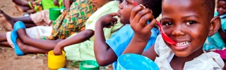 A child enjoys food from Mary's Meals in Malawi