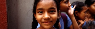 A girl turns to face the camera and smile