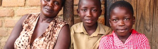 Picture of mother & children looking into camera