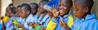 Children in Malawi eating Mary's Meals