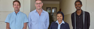 Gebrisha standing with Alex Keay & Magnus MacFarlane-Barrow of Mary's Meals, as well as Sister Medhin from our partner Daughters of Charity in Ethiopia. 