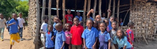 A group of children outside a school in Mozambique