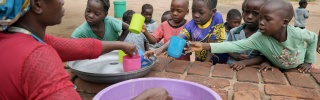 2025 - Zambia - children being served meals