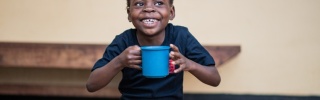 Boy eating Mary's Meals