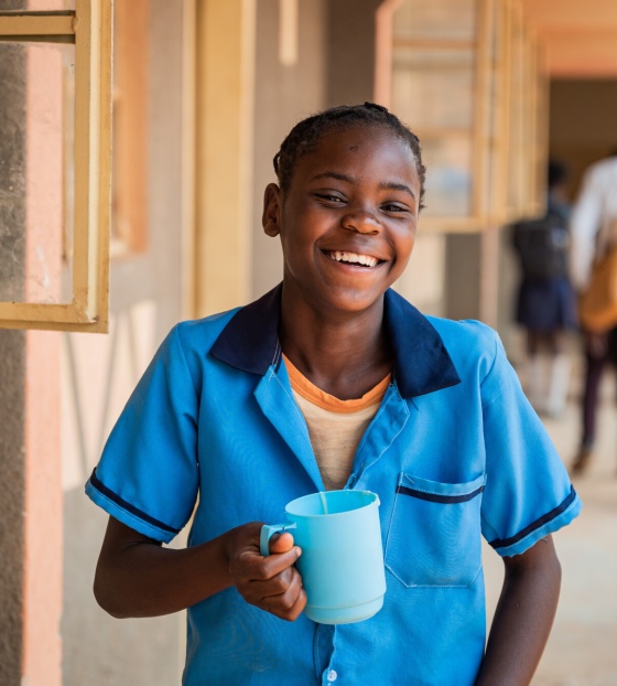 Mary getting on with her studies with the help of Mary's Meals