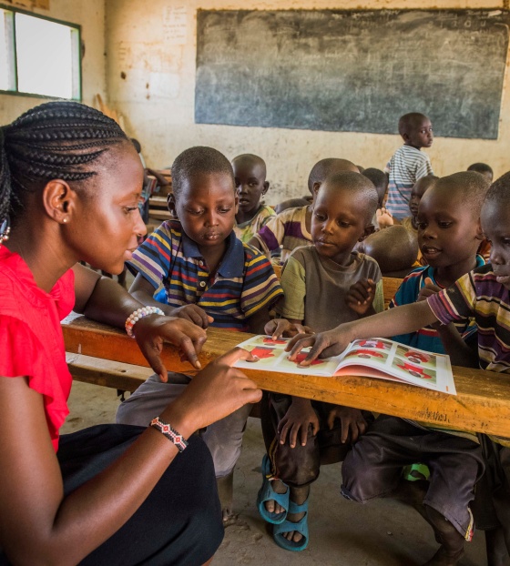children in class listening attentively to their teacher 