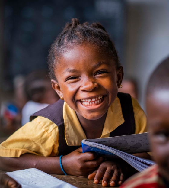 A Liberian child sitting in class gaining an education. 