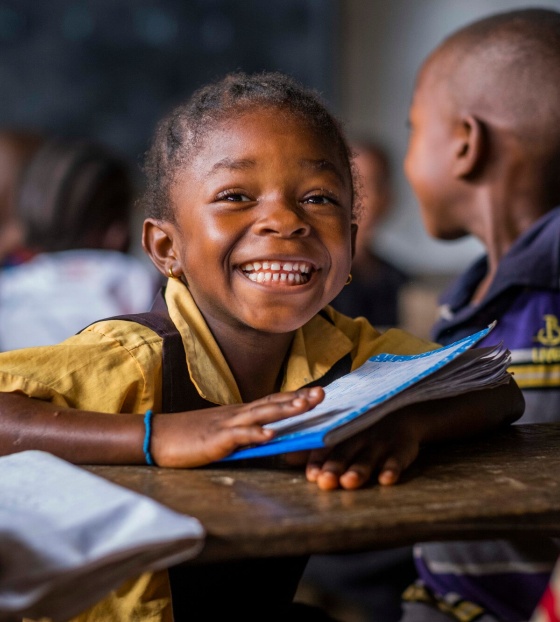 A Liberian school child learning in class. 