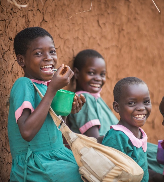 Children in Malawi eating Mary's Meals