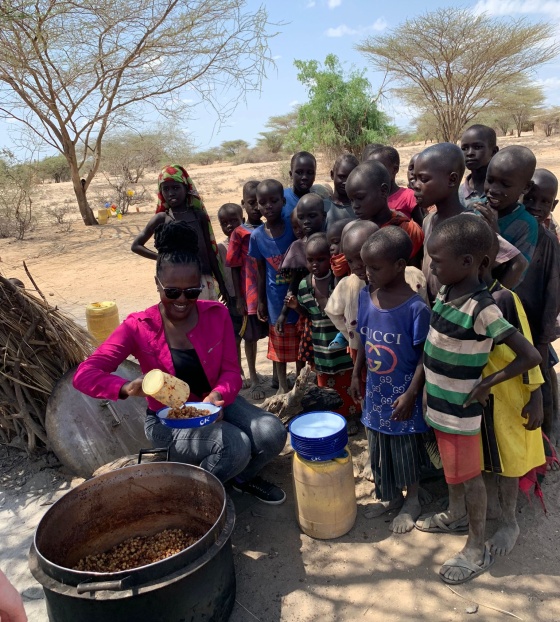 group of people lining up for food