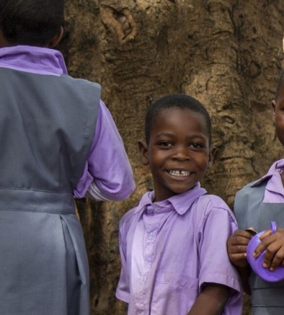 Children waiting to be served Mary's Meals at school in Malawi.