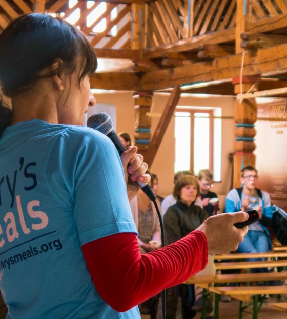 A fundraiser in the Czech Republic talks to a crowd