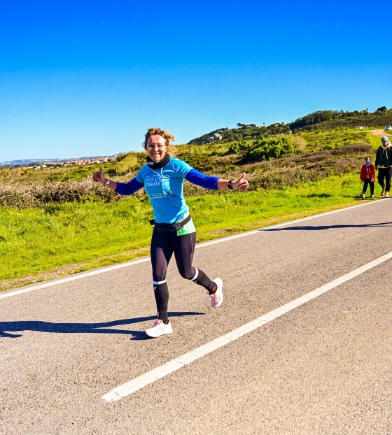 MM Volunteer running in a marathon to raise money for charity.