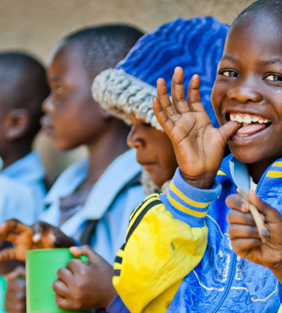 Children in Malawi eating Mary's Meals