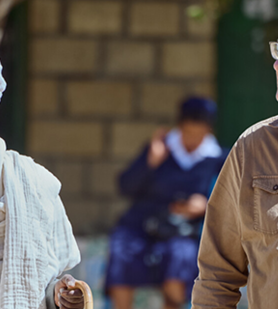 Magnus MacFarlane Barrow walking with a community elder in Tigray, Ethiopia.